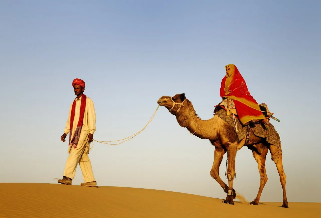 Traditional camel safari journey in the Thar Desert near Jaisalmer